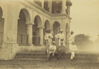 Portrait of group with Arthur Rimbaud pressed on his rifle, caption 'Near Aden. Before lunch, Sheikh-Othman, circa 1880'.